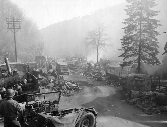 0000-German_Trucks_Wrecks_On_Road_Durkheim_Germany_1945